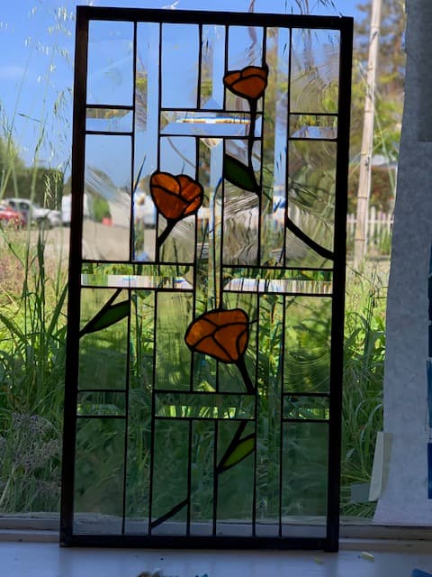 California poppies stained glass panel in clear beveled glass with orange blooms